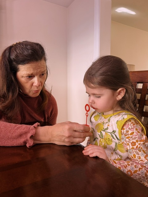 Elizabeth working with a child